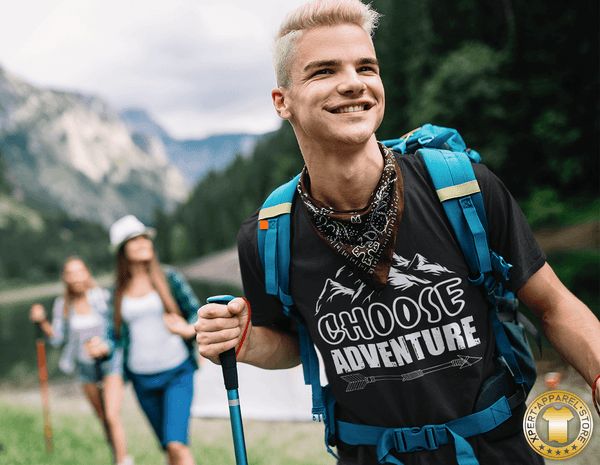 Guy Hiking in the mountains with friends wearing black t-shirt with "Choose Adventure" design on the front, Available from the Xpert Apparel Store.