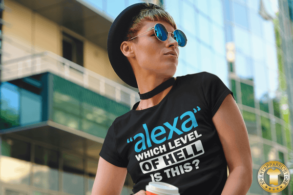 Lady with coffee in hand wearing black t-shirt with funny, sarcastic Alexa question "Alexa" which level of hell is this t-shirt design, available from the Xpert Apparel Store.