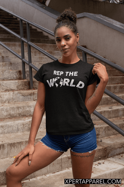 Woman Standing On Stairs wearing black T-shirt with Rep The World Design from Xpert Apparel Shop