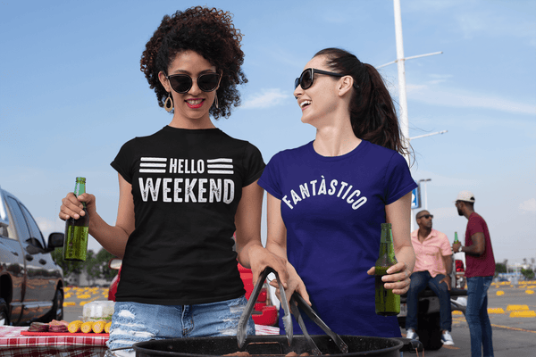 Two female friends at a tailgate party one wearing a Hello Weekend t-shirt and the other a Fantastico design