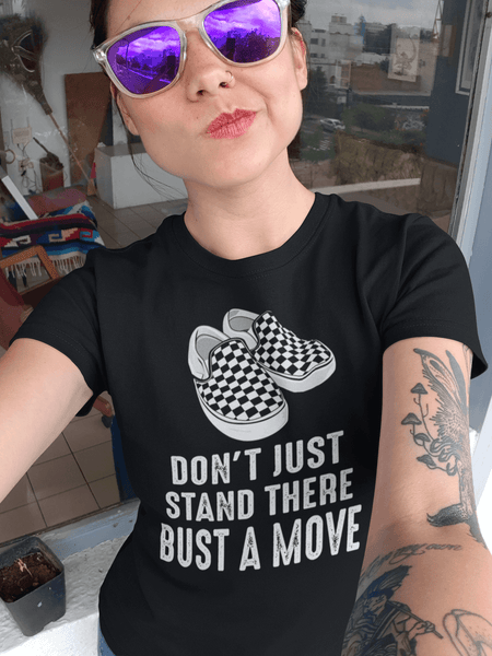 Lady Taking selfie wearing a don't just stand there bust a move design from the Xpert Apparel Store