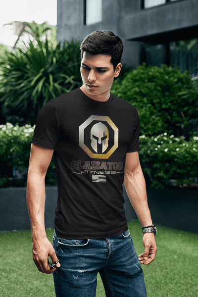 Guy in outdoor park wearing Black T-shirt with Gladiator Fitness Logo design on the front Available from the Xpert Apparel Store.