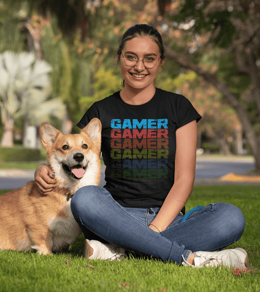 Female Siting in park with her dog wearing black T-shirt with Faded Out Gamer Design from The Xpert Apparel Store