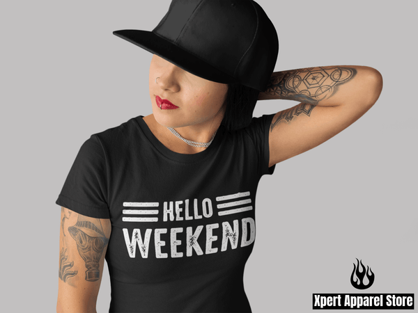 Woman with tattoos on her harm in black hat wearing a Hello Weekend T-shirt design