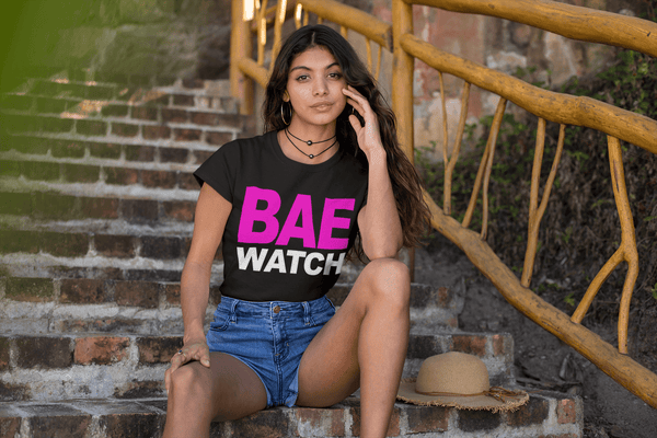 Lady sitting on Stairs in short jeans shorts and Black T-shirt with Bae Watch design from the Xpert Apparel Store